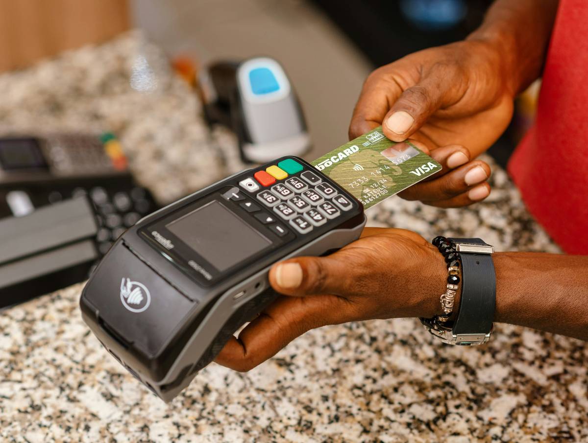 liability rule what credit card are illustrated with two people holding a credit card split down the middle, one side labeled '100% liable' and the other 'also 100% liable'